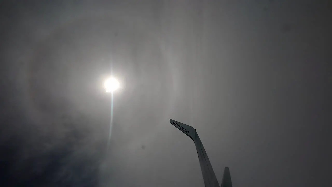 Ryanair plane wing with logo in the moon light reflexion in foggy sky