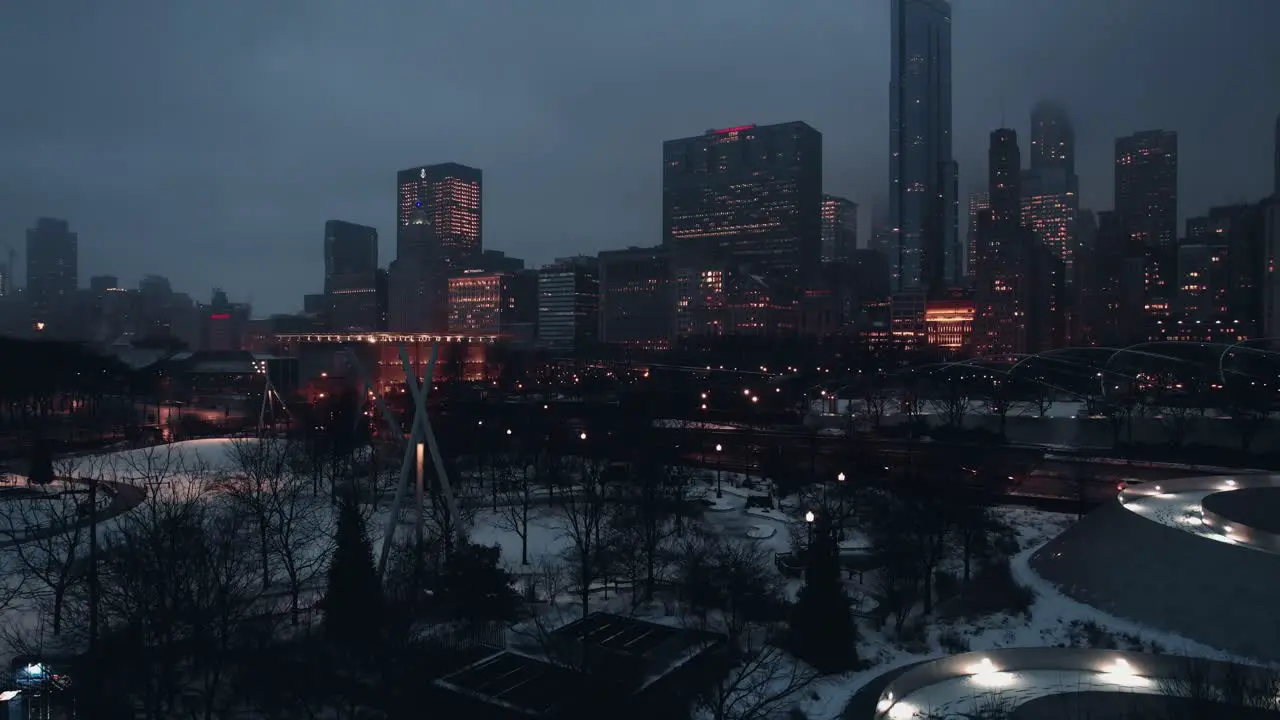 crane shot of chicago cityscape downtown shows a well-lit metropolis with a lot of tall buildings and streetlights