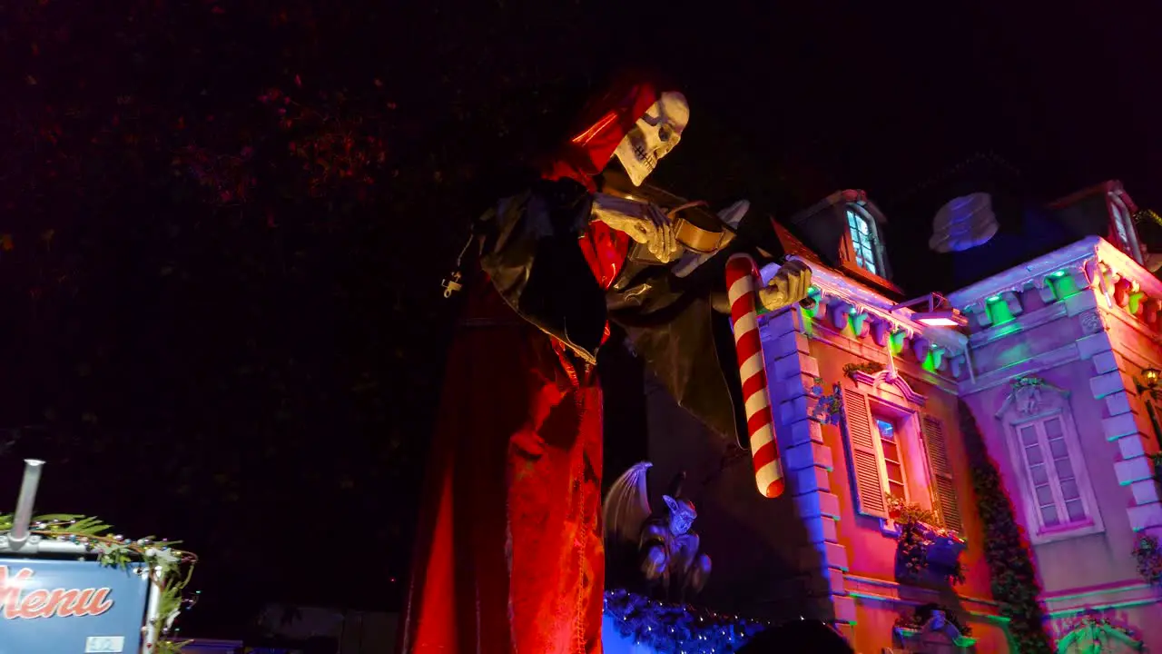 Low angle shot of house of fear in the style of Dracula's Castle in an amusement park in London UK at night time