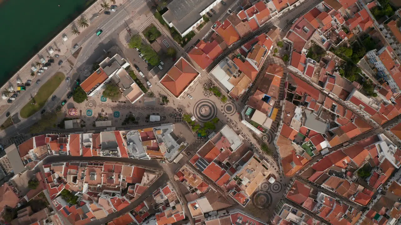 Gil Eanes square in Lagos seen from aerial drone birds eye overhead top down view slowly rising up Algarve Portugal day