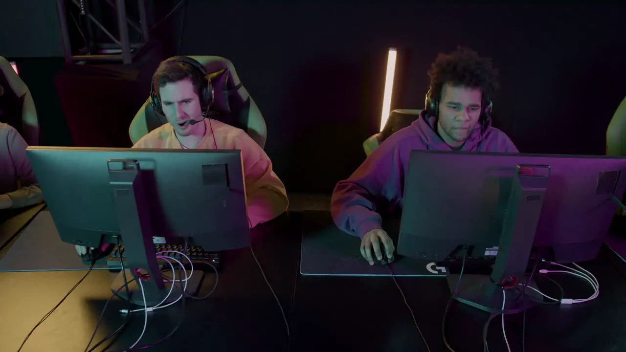  Team Of Cybersport Gamers Playing Video Games In A Gaming Club