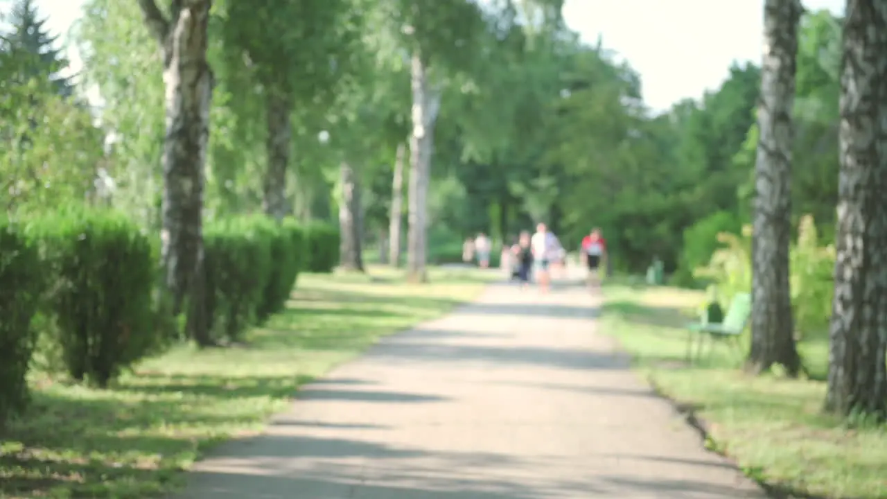 Pretty Blonde Girl Running In The Park In A Sunny Day