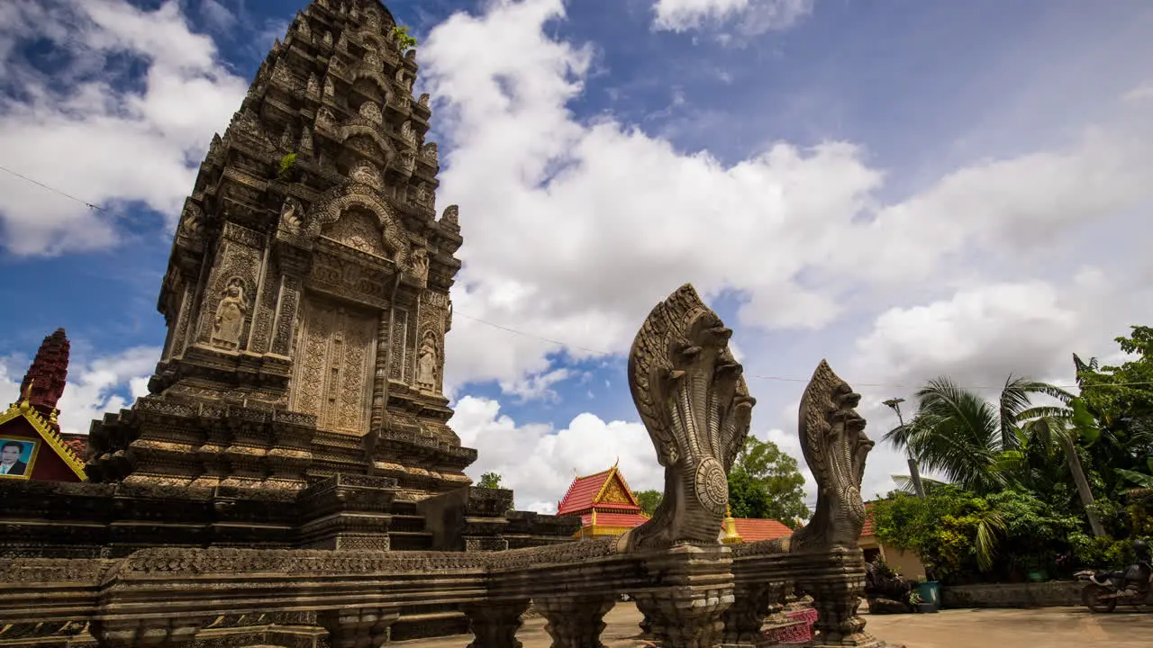 Angkorian like temple structure with protective naga snake at the entrance