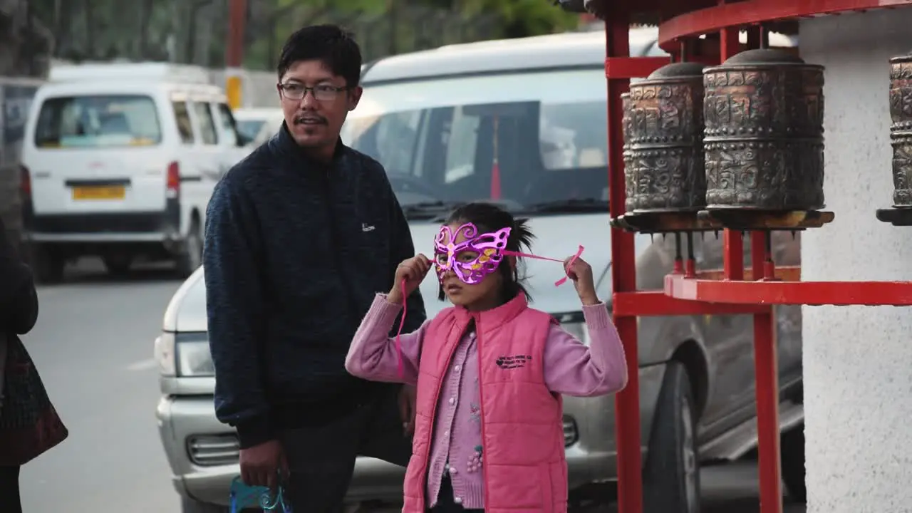 A Parent and a Child Walking and laughing in the streets