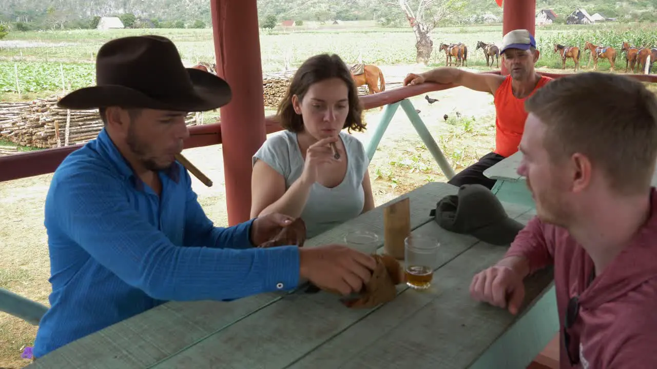 Local Cuban Man Showing Tourists How To Make Cigar