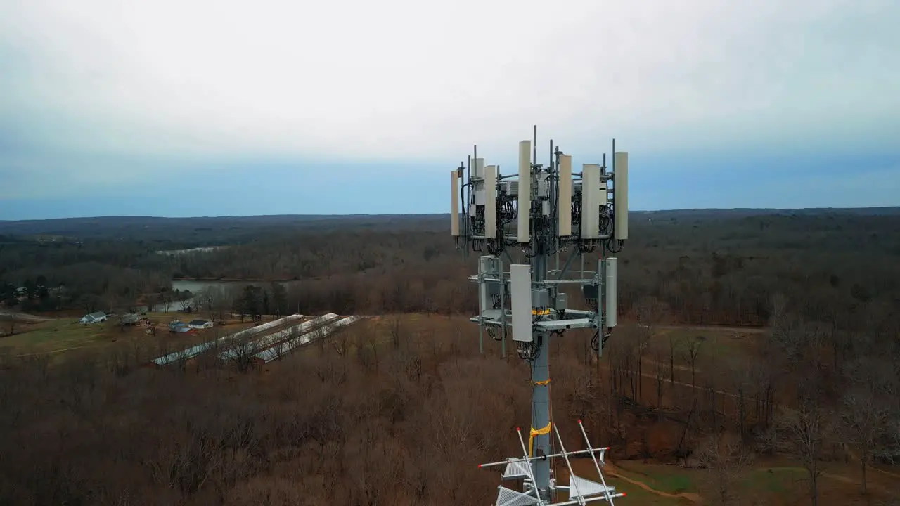 Aerial Reverse Shot of Cell Phone Tower in Forest