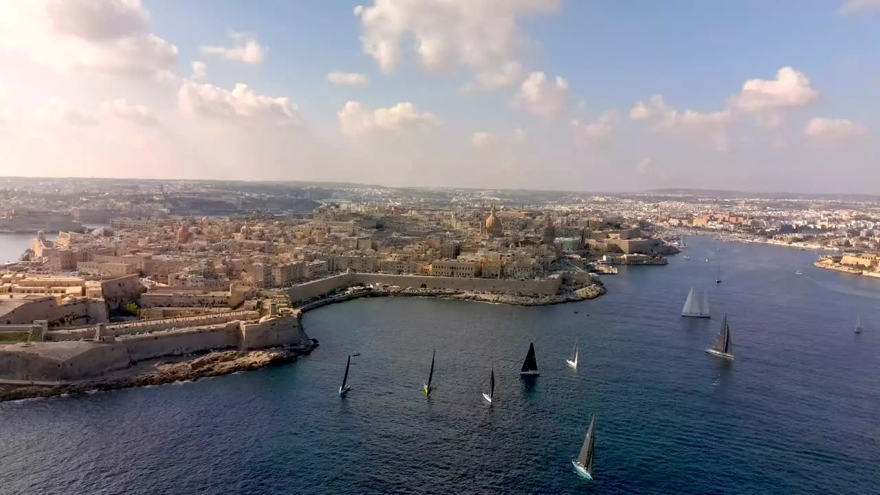 Establishing shot tracking out of Malta's Yacht race