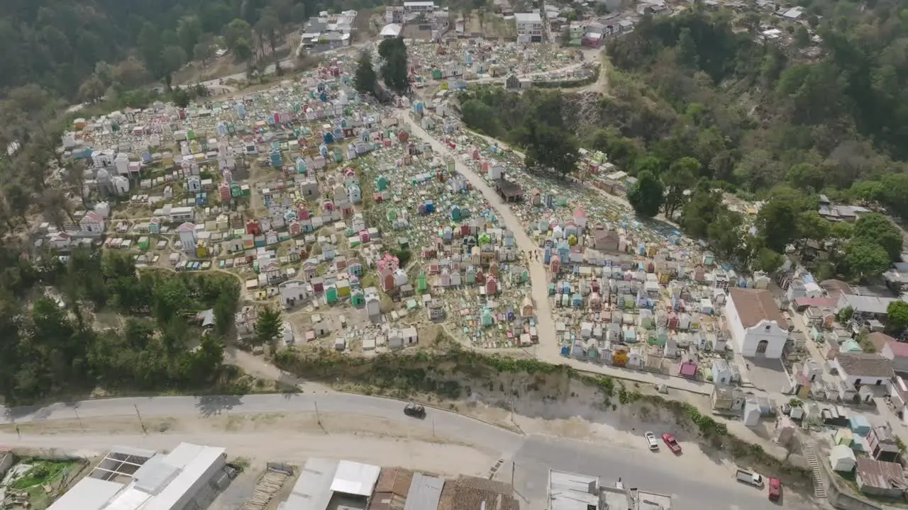 Aerial top down footage that gimbals towards a colorful cemetery in Chichicastenango Guatemala