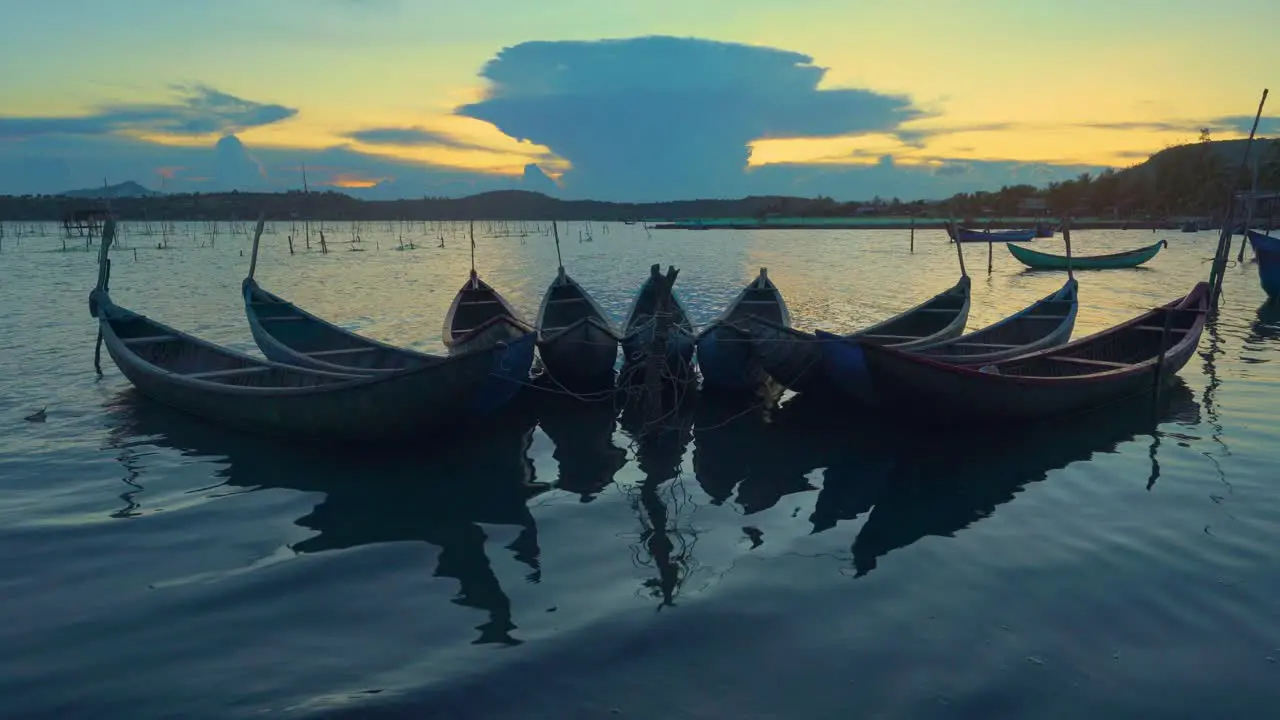 Wooden boats on O Loan lagoon in sunset Phu Yen province central Vietnam