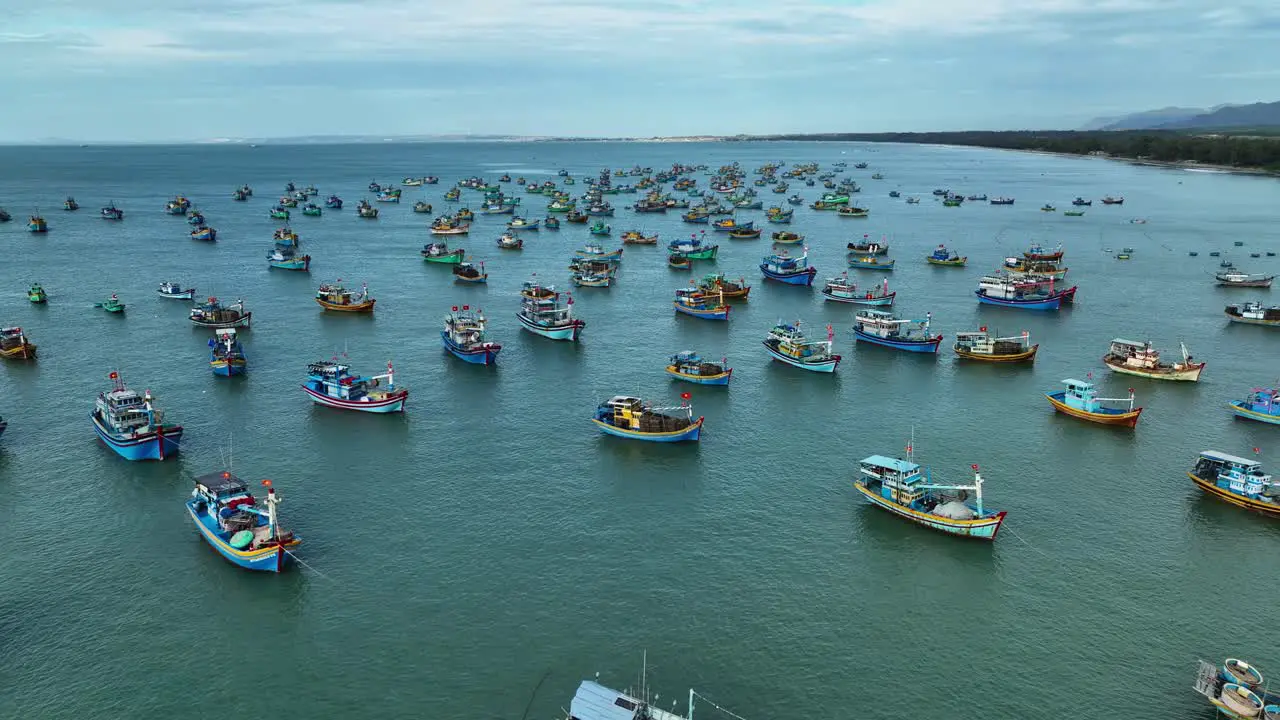 Drone view hundreds of fishing boats nailing on La Gan beach of Binh Thuan central Vietnam