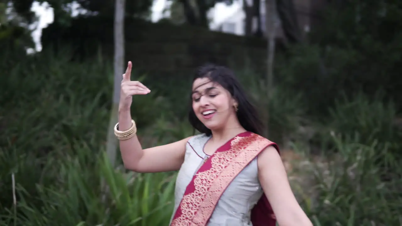 Beautiful Indian Woman Dancing Classical Dance In The Garden medium