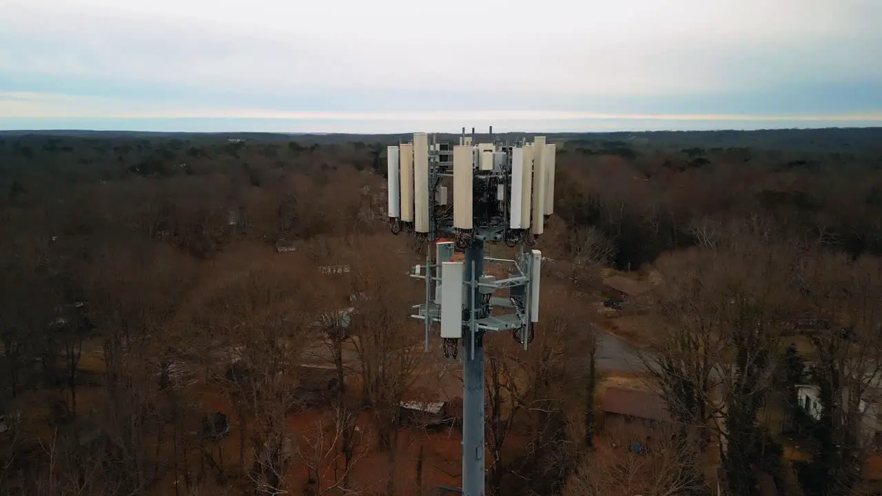 Aerial Shot Rotating Around Cell Phone Tower in Forest