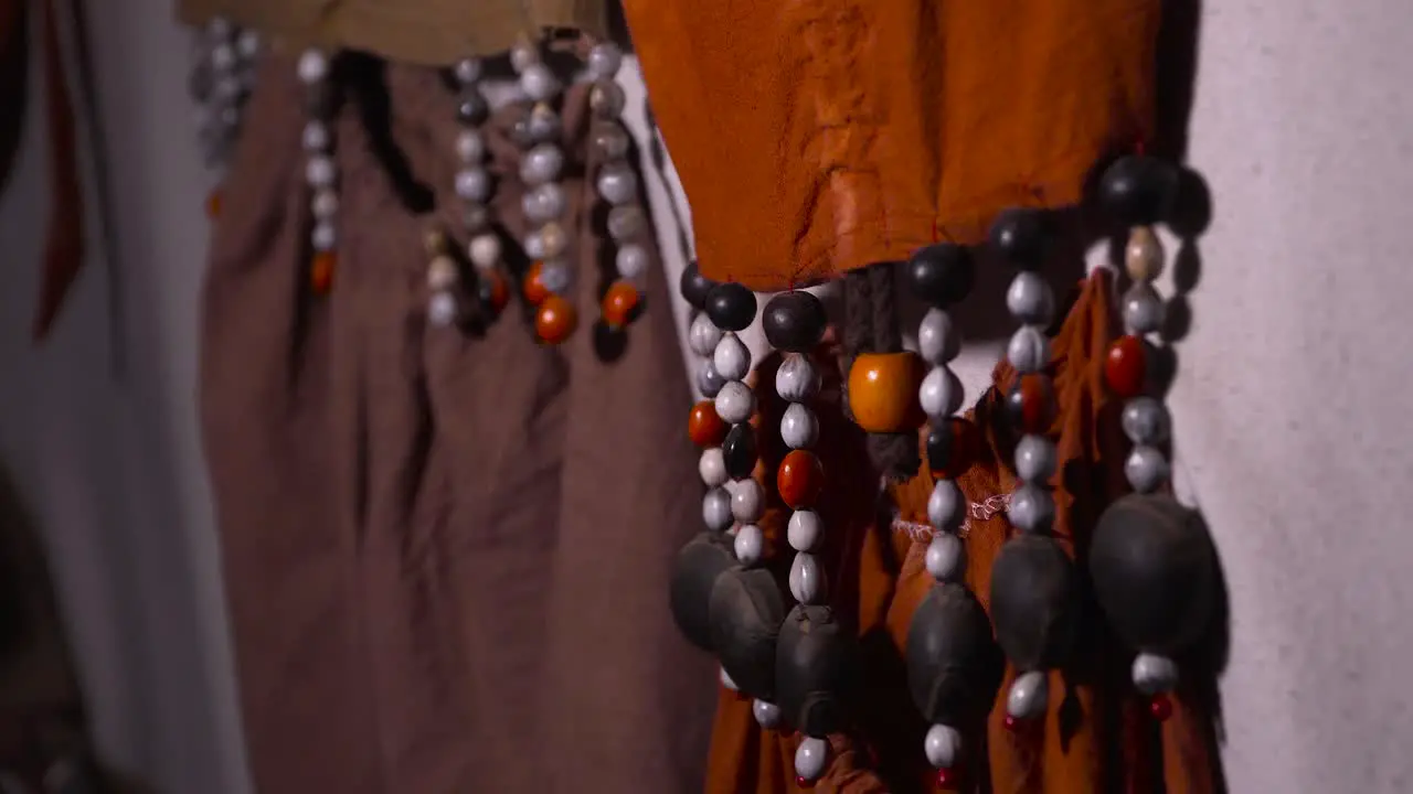 A macro shot focuses on the beads at the ends of the traditional clothing worn by Shipibo indigenous people