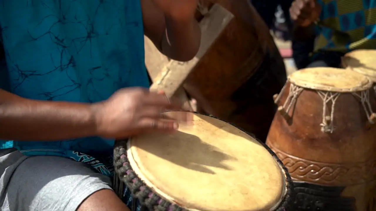 Drummers play at a festival in rural Ghana West Africa as captured in slow motion