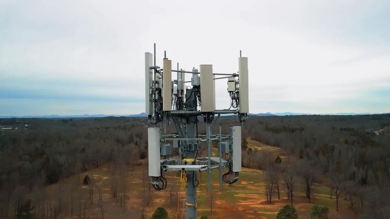 Stunning Aerial Rising Shot of Cell Phone Tower in Middle of Forest