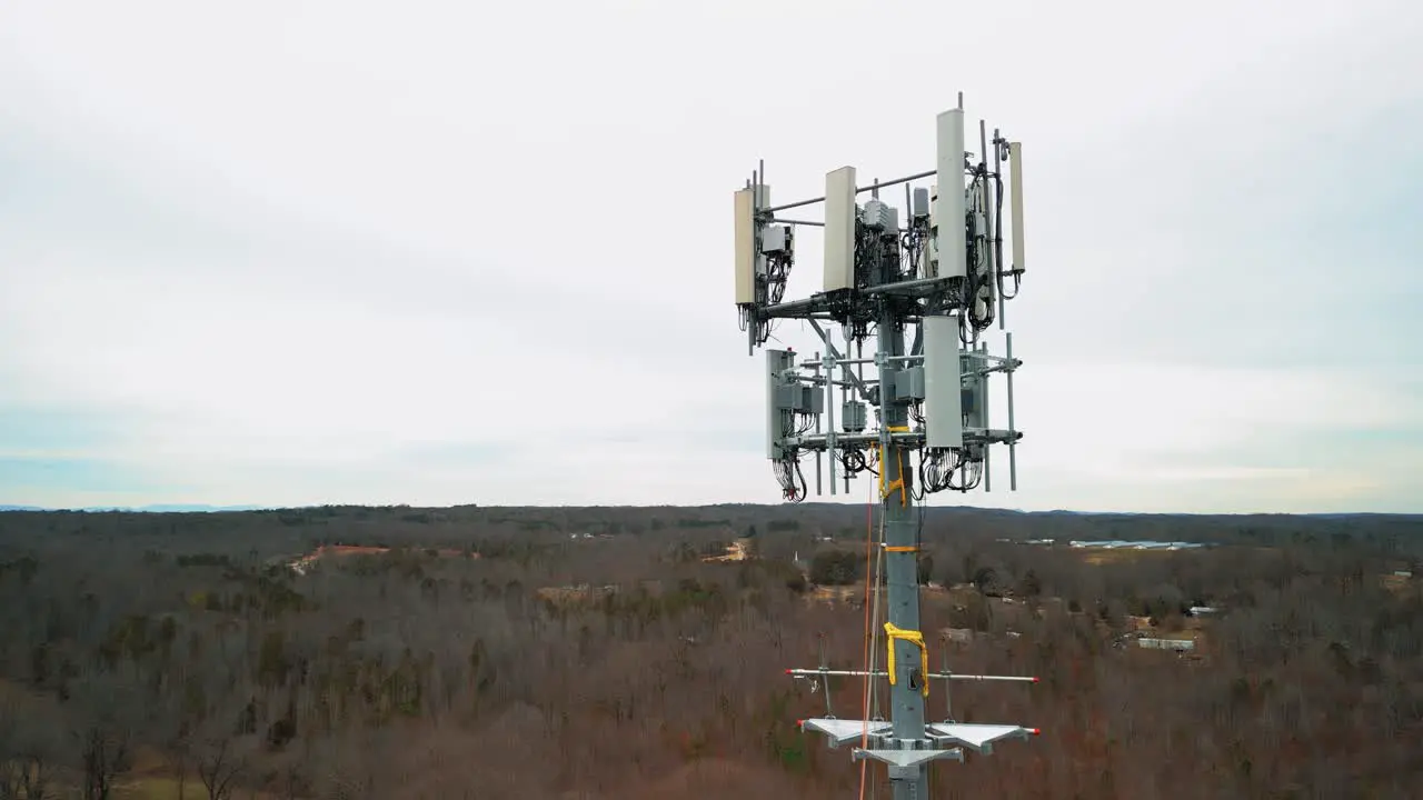 Aerial Shot Flying Toward Cell Phone Tower in Forest