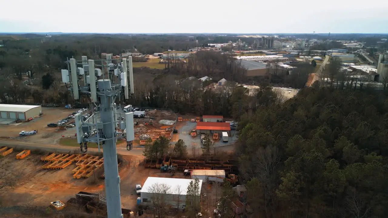 Aerial Tilting Shot of Cell Phone Tower in Forest