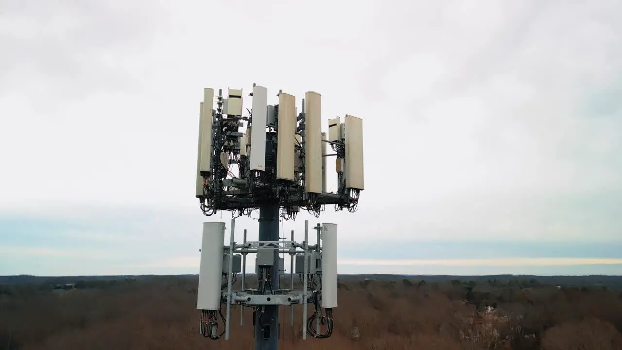 Aerial Rising Shot of Cell Phone Tower in Forest