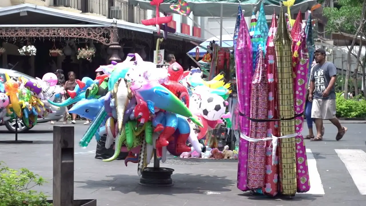 Balloon seller in front of the Plaza de Armas in Cuernavaca Mexico