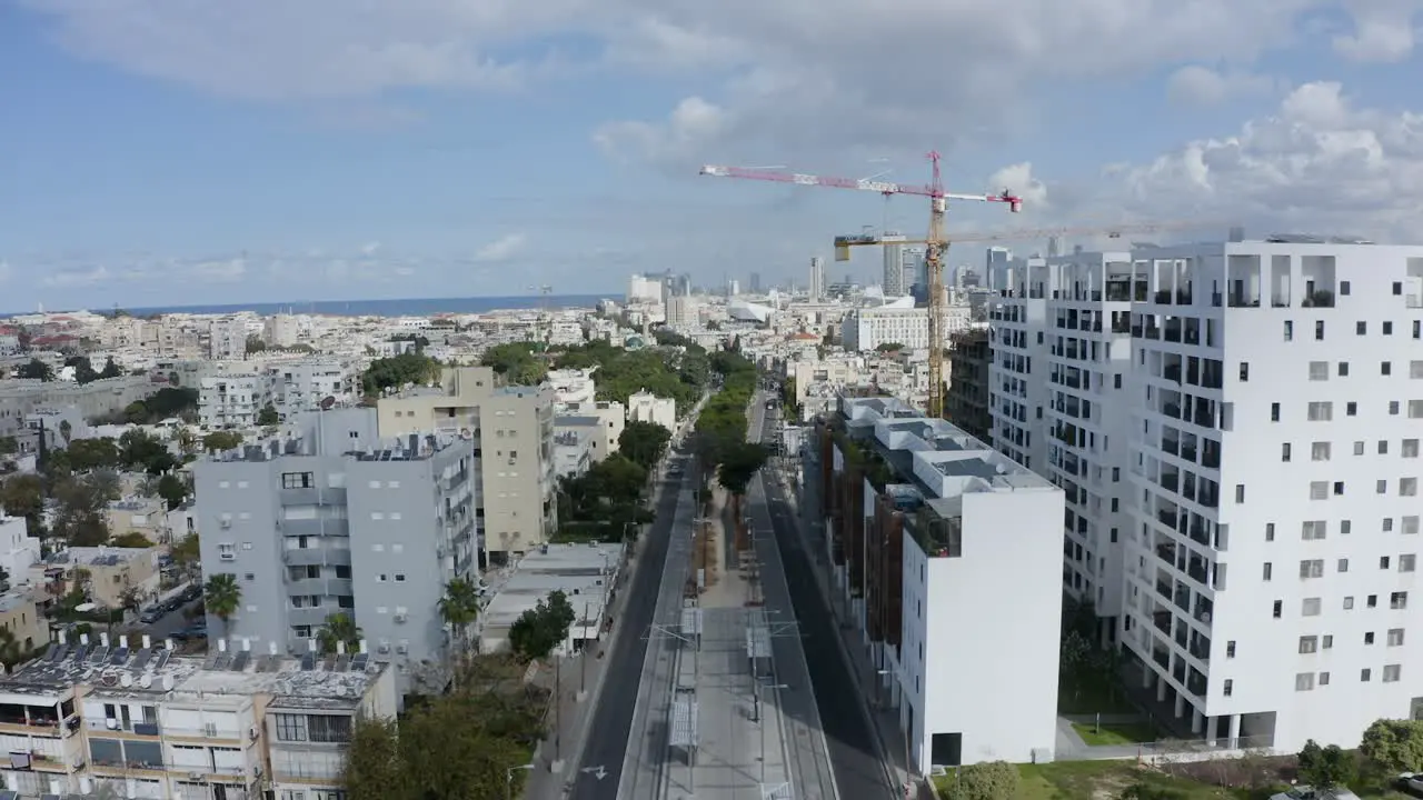 Suburban street with residential buildings establishing aerial view of Tel Aviv