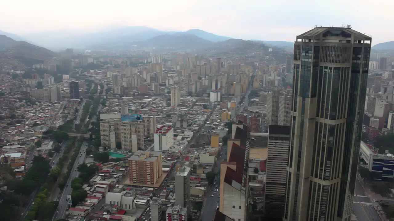 4K Aerial view of one of the Central Park towers in the city center as well as view of the Valle-Coche highway and much of western Caracas Venezuela