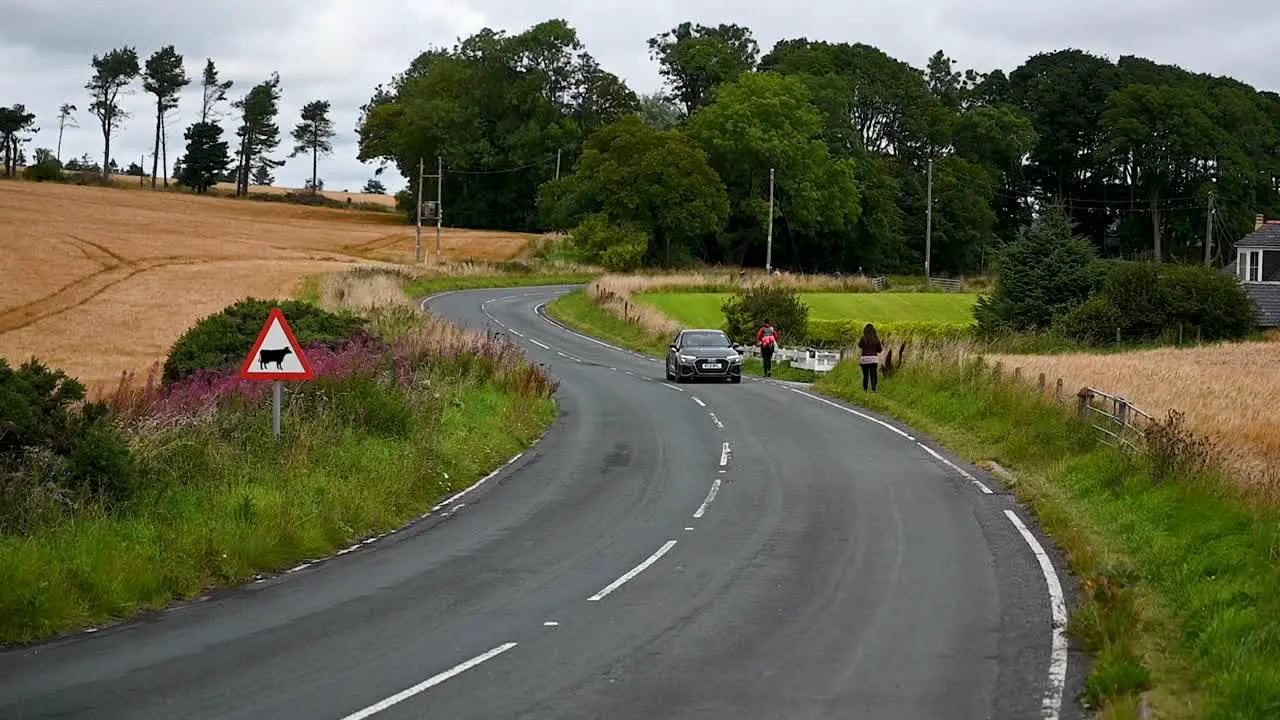 Audi driving past the cow sign in Dundee Scotland United Kingdom