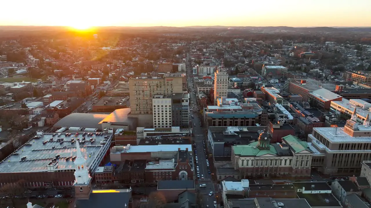 High aerial truck shot of Lancaster Pennsylvania city skyline during winter sunset