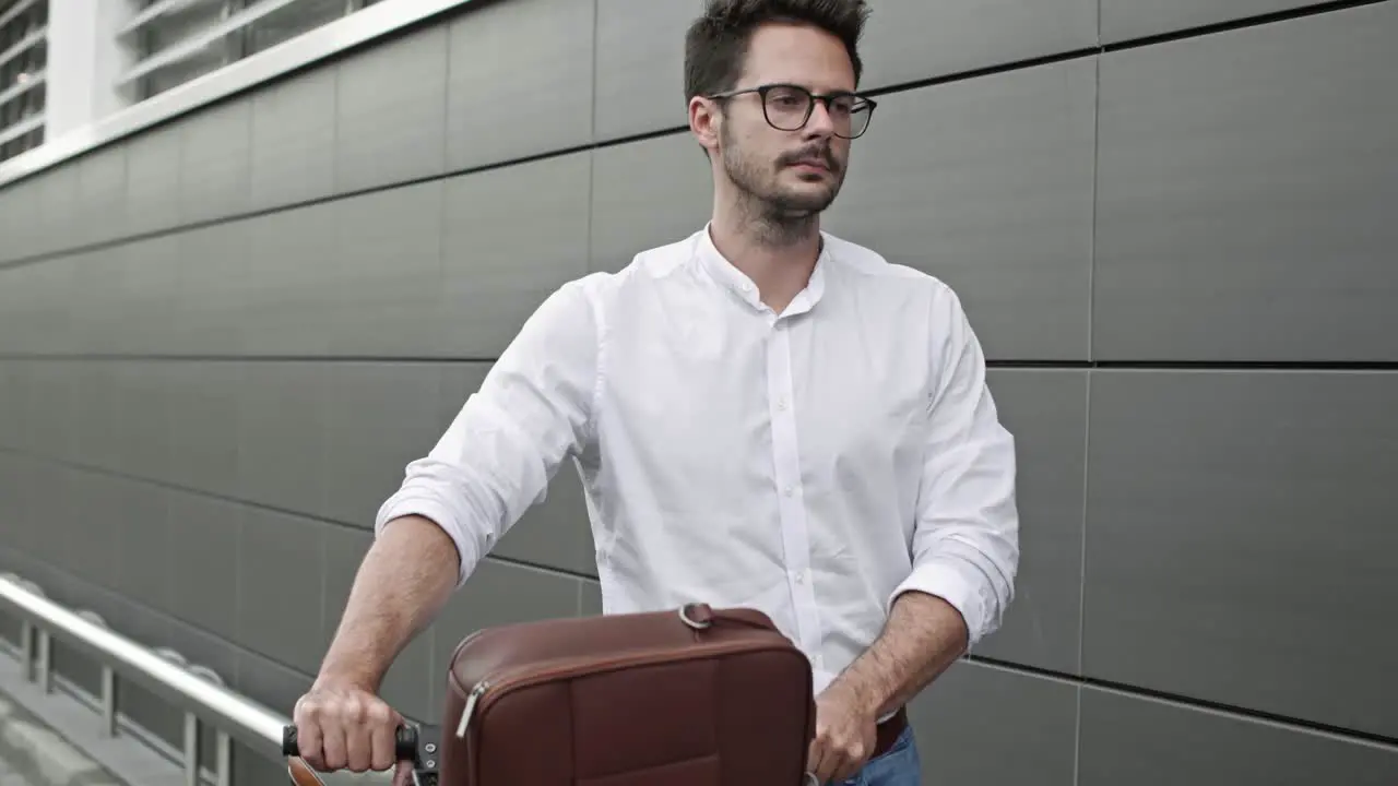 Businessman with bicycle walking