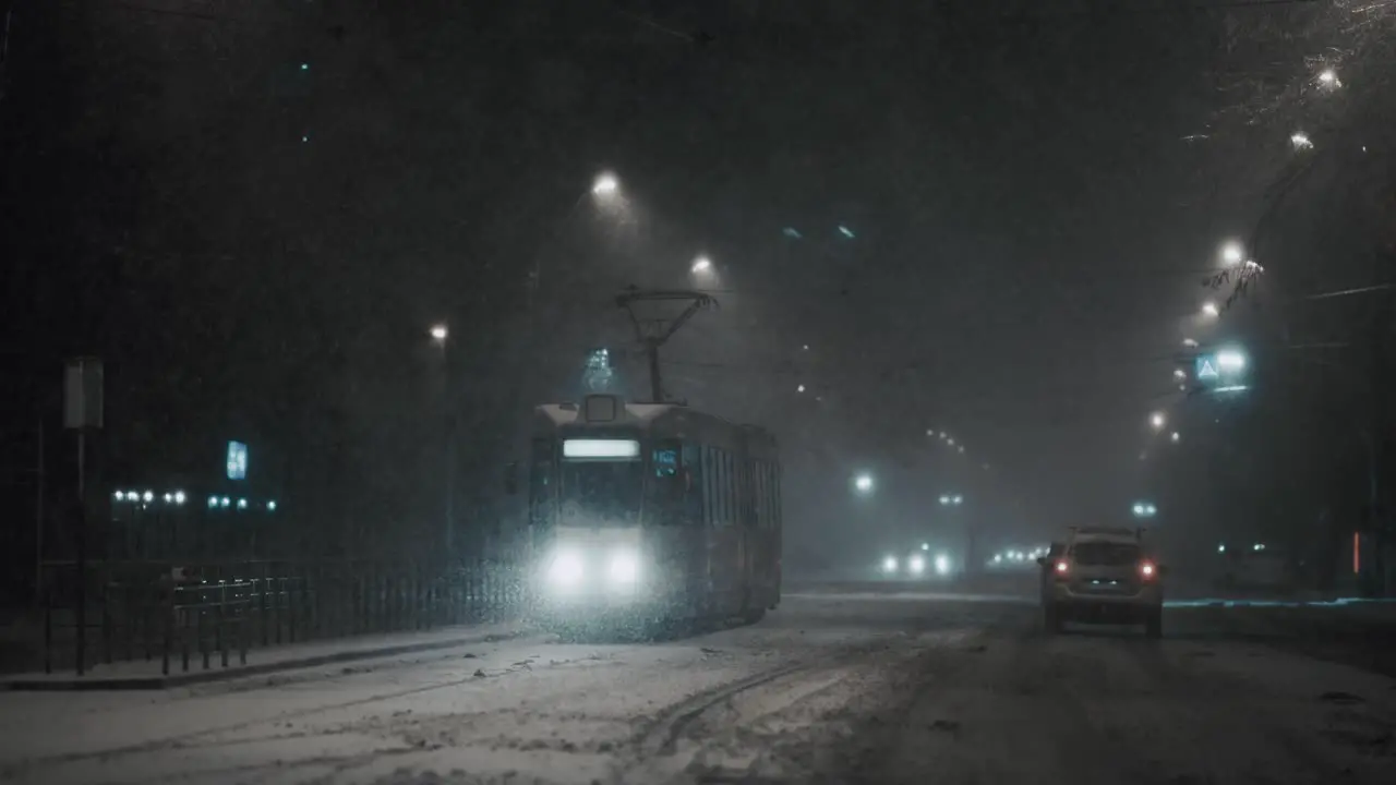 Tram parked in the station on a frosty winter night blizzard snow storm