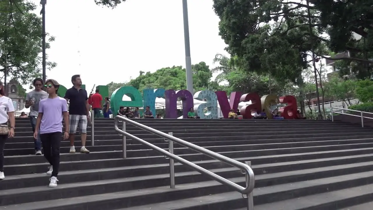 People walking down stairs in front of Plaza de Armas in Cuernavaca Mexico