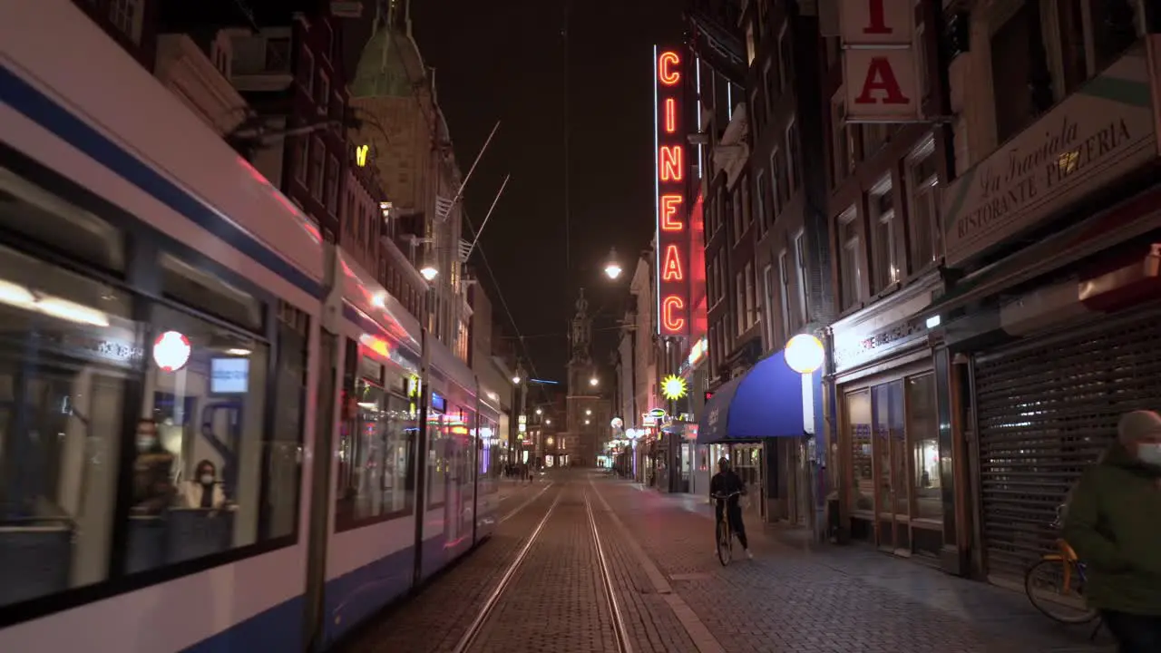 Tram passing by in the historical street of Amsterdam