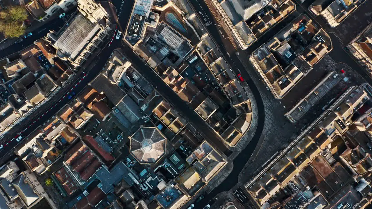 Top down drone shot of old building blocks and streets in Bath city centre UK