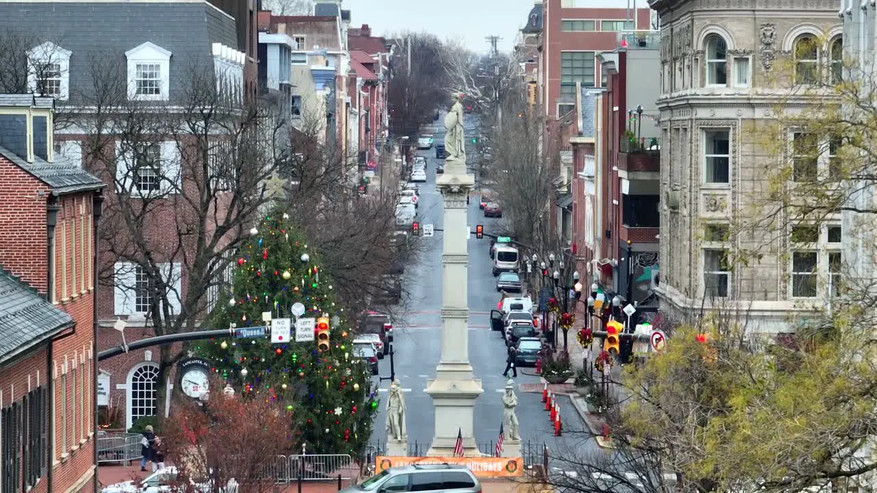 Aerial view of snowy Christmas scene in American city square