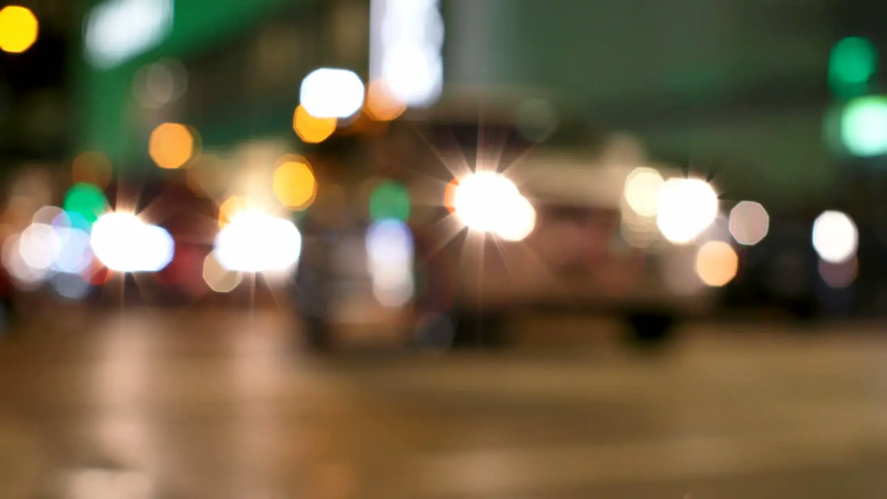 Colorful bokeh of car lights at traffic signal on street at night 4k