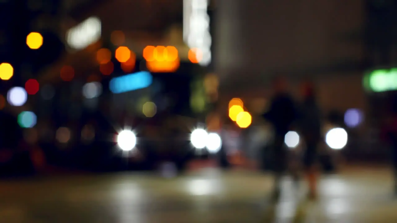 Colorful bokeh of vehicle lights at traffic signal on street at night 4k