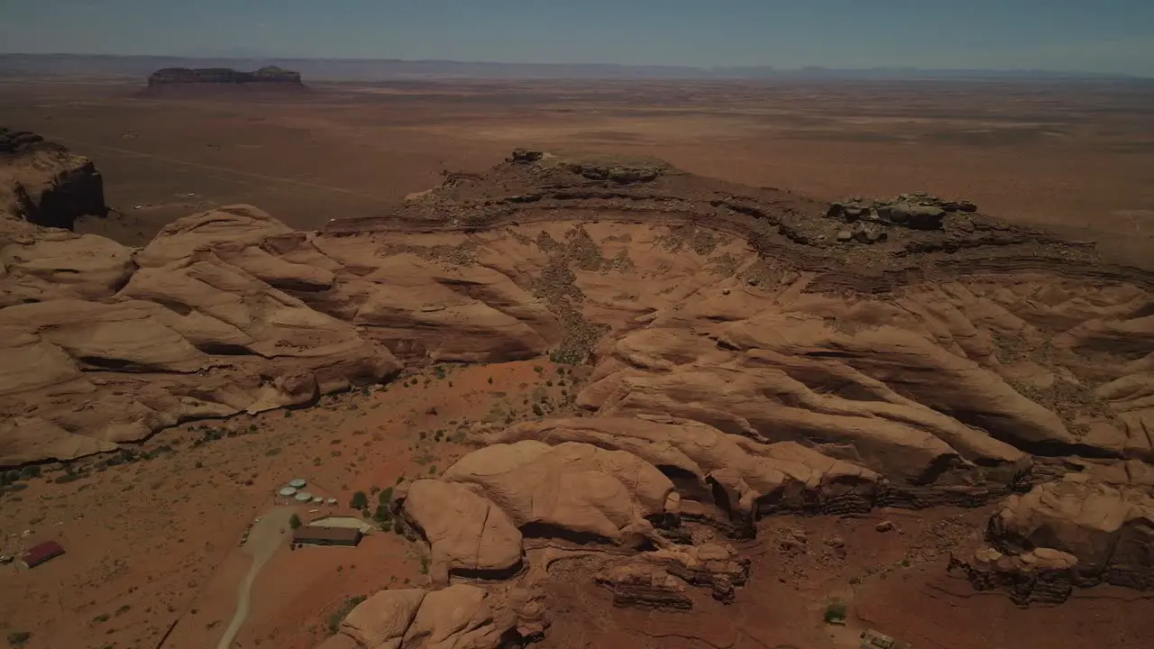 Aerial drone footage captured the landscape of Death Valley Mountain with vehicles coming to a halt in the midst of it