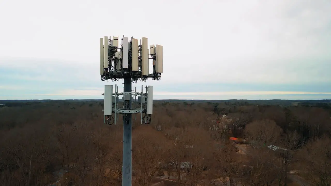 Aerial Shot Reversing to Show Cell Phone Tower in Forest