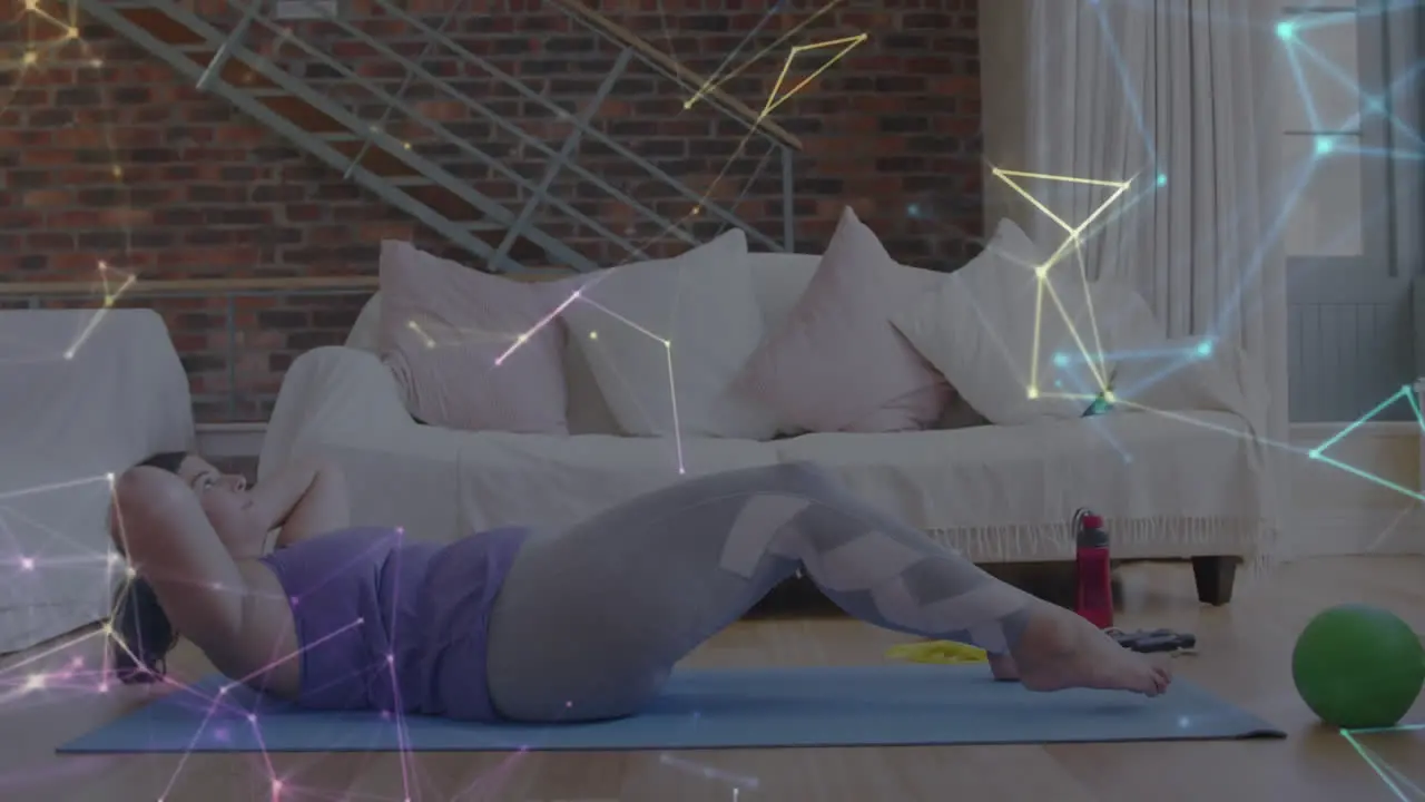 Glowing network of connections against caucasian woman performing crunches exercise at home