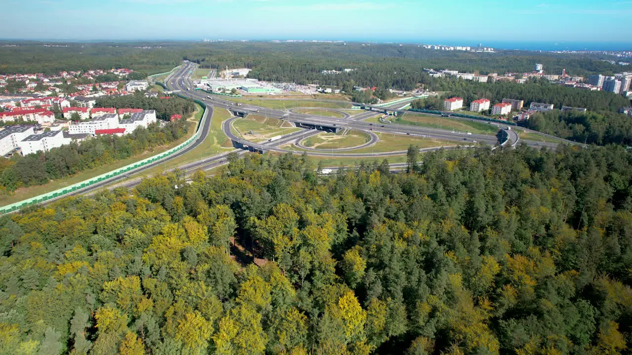 Aerial fast traffic road and large road intersection in the background view of the city and the Bay of Gdansk in the city of Gdynia district Gdynia Redłowo