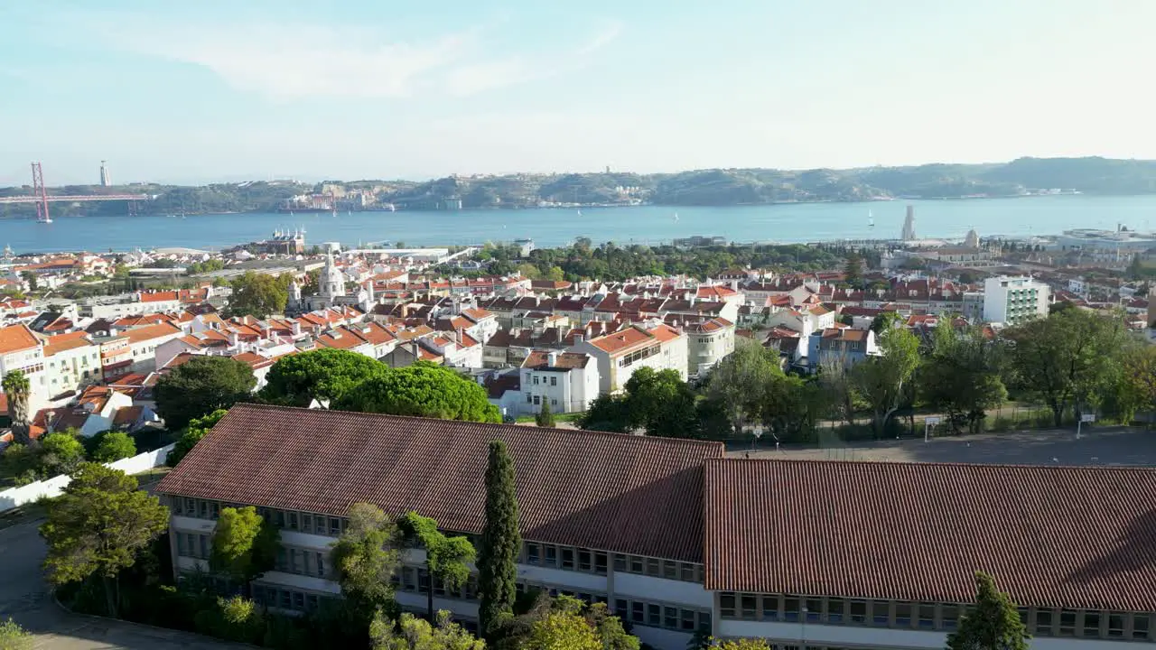 View of Tagus river Almada city and 25 de Abril bridge from embankment in Lisbon in December