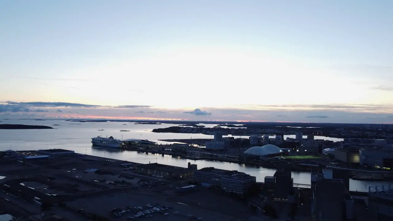 Low evening flyover of shipping piers of Helsinki Finland waterfront