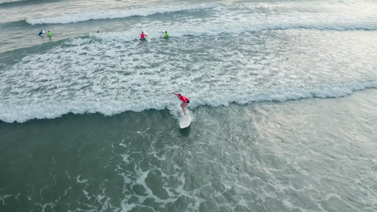 4K Aerial Drone Following Shot of Surfer Taking Lesson in Tambor Costa Rica