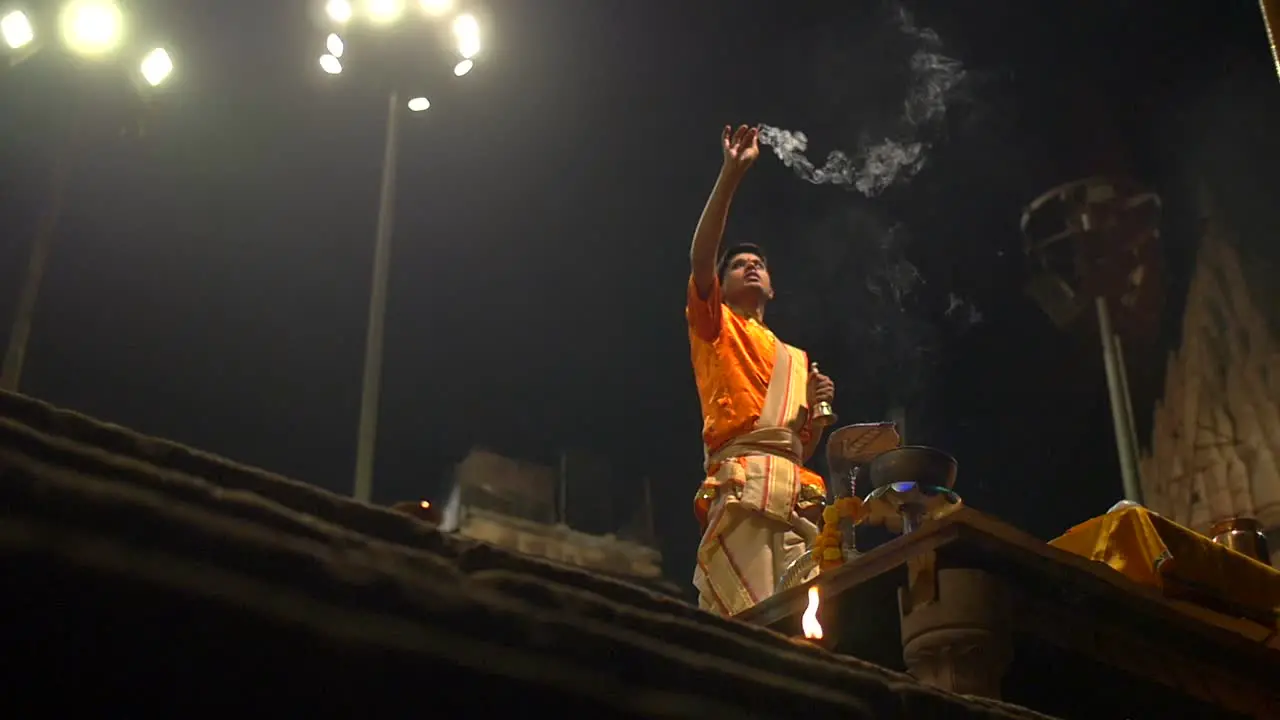 Man Waves Incense at Ganga Aarti Ceremony