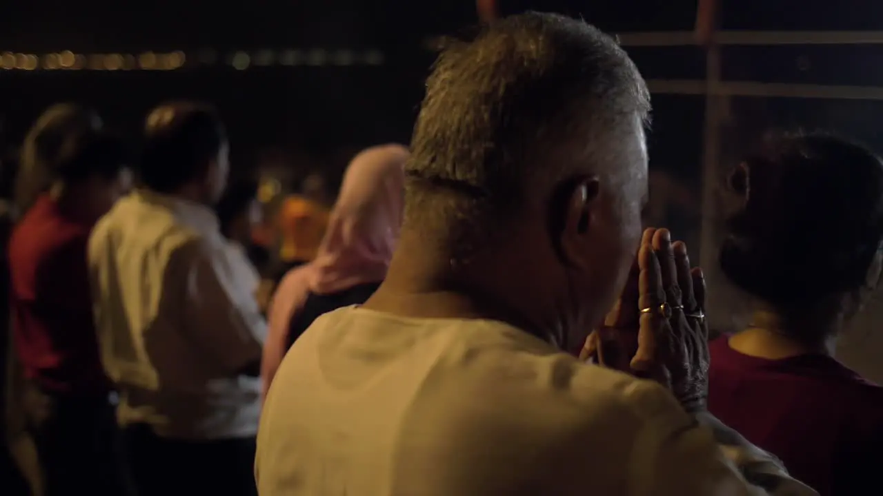 A Man Praying at Religious Ceremony in Varanasi