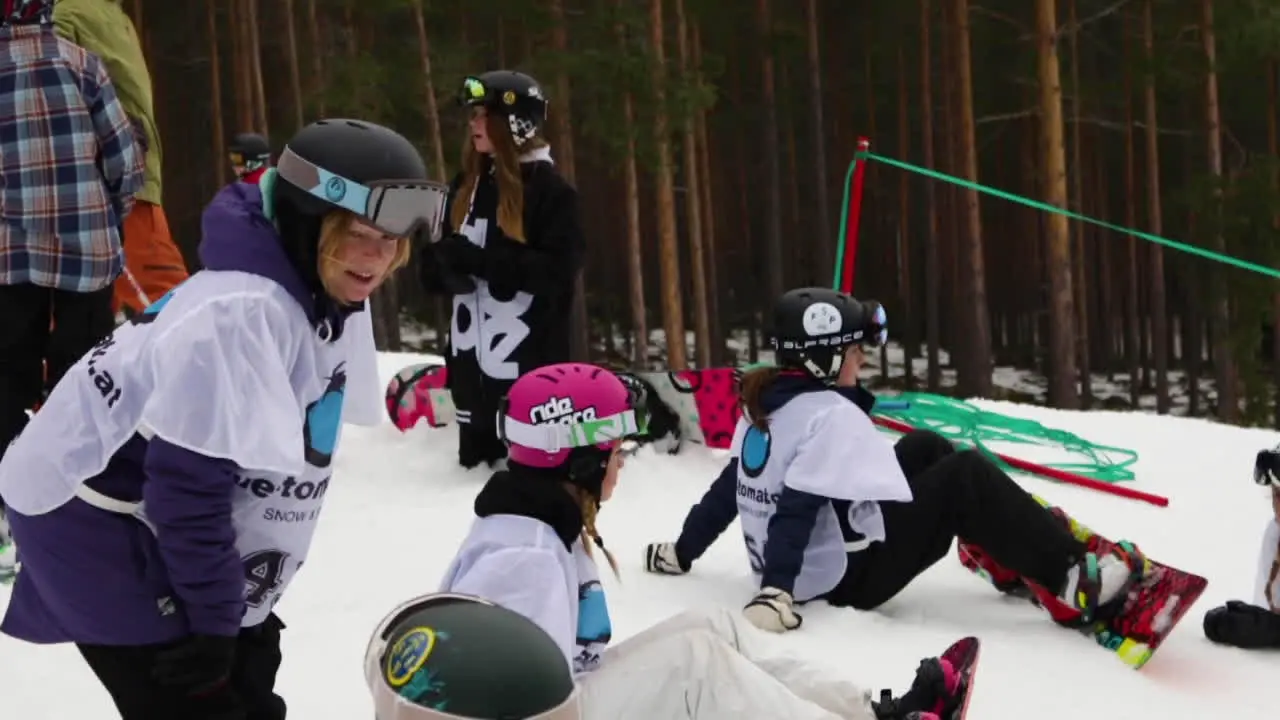 Slowmotion Shot of Snowboarding Girls at a Competition in Sweden