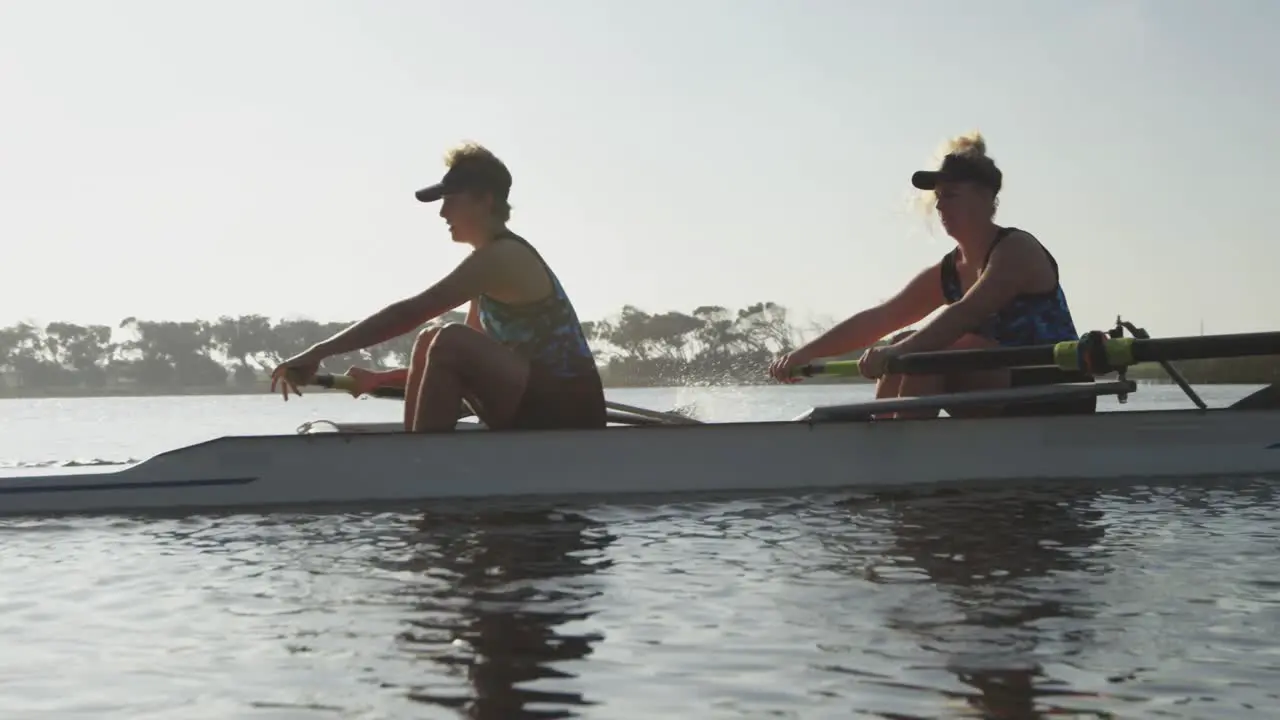 Female rowers training on a river