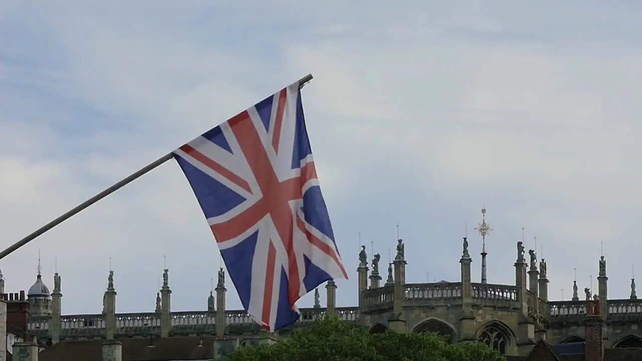 Slow Motion British Flag Union Jack Flag Waving in the Wind in front of a Church in Windsor