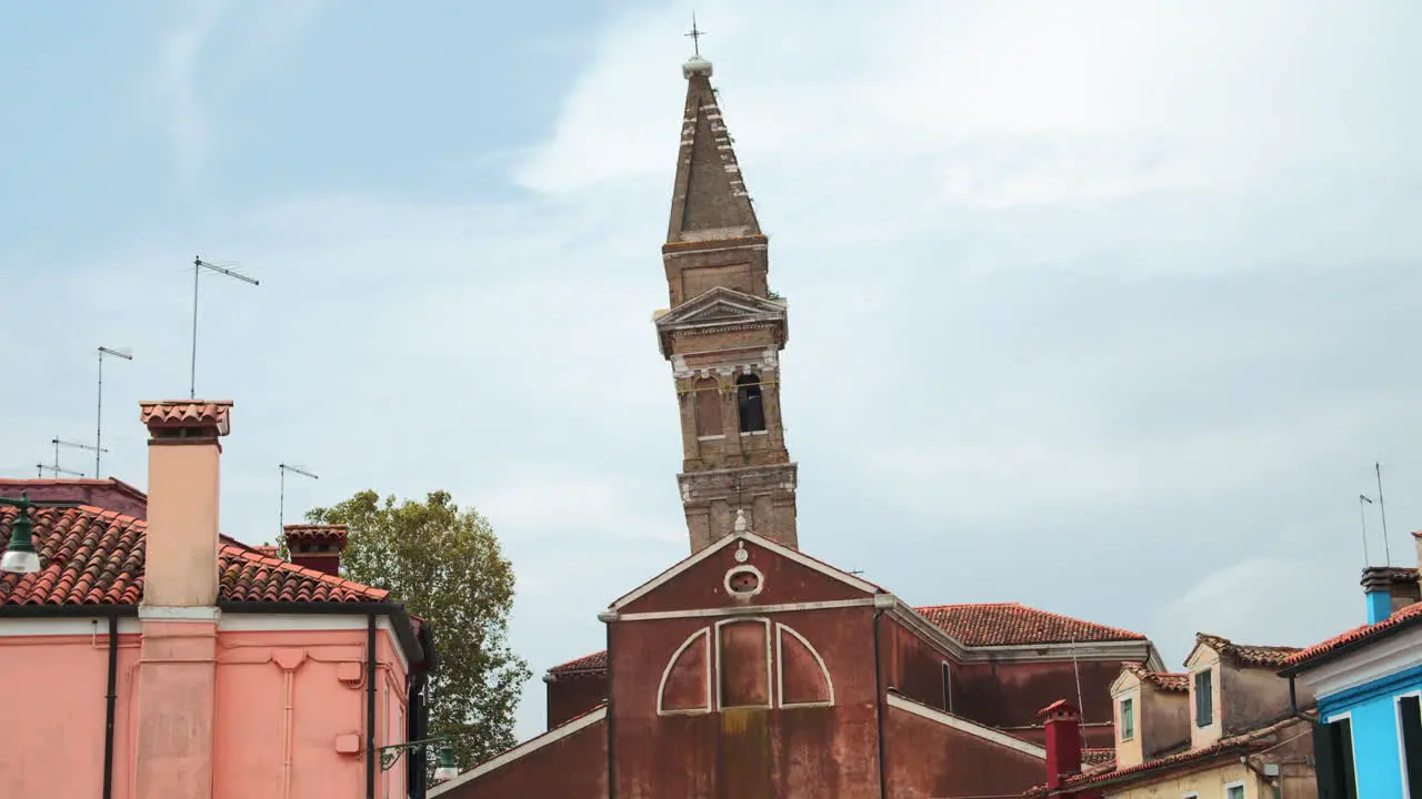 Leaning Tower at Cappella di Santa Barbara Burano Venice Italy on a sunny day