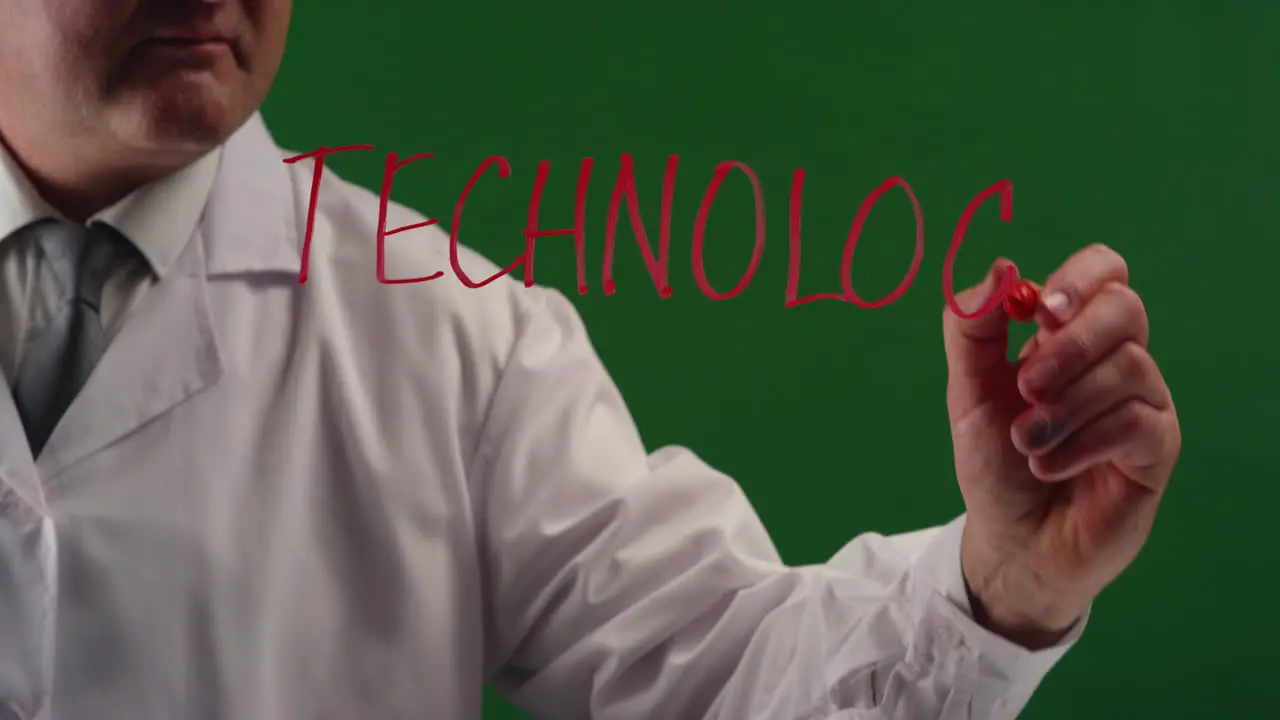 Man Writing Word Technology' On Green Screen