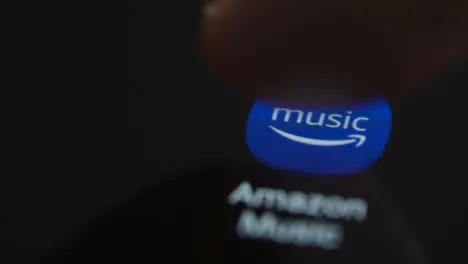 Close Up Shot of a Finger Tapping Amazon Music On a Smartphone Screen